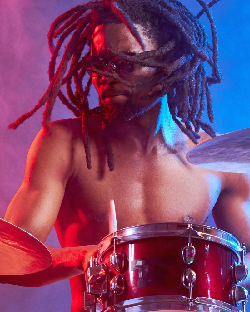 Drummer under stage light